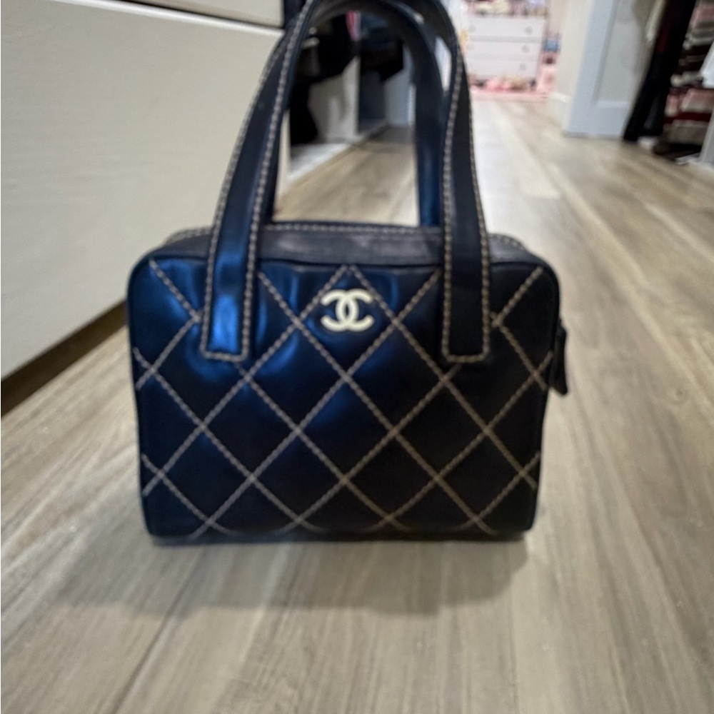 CHANEL Black Quilted Leather Satchel with Contrasting Stitching